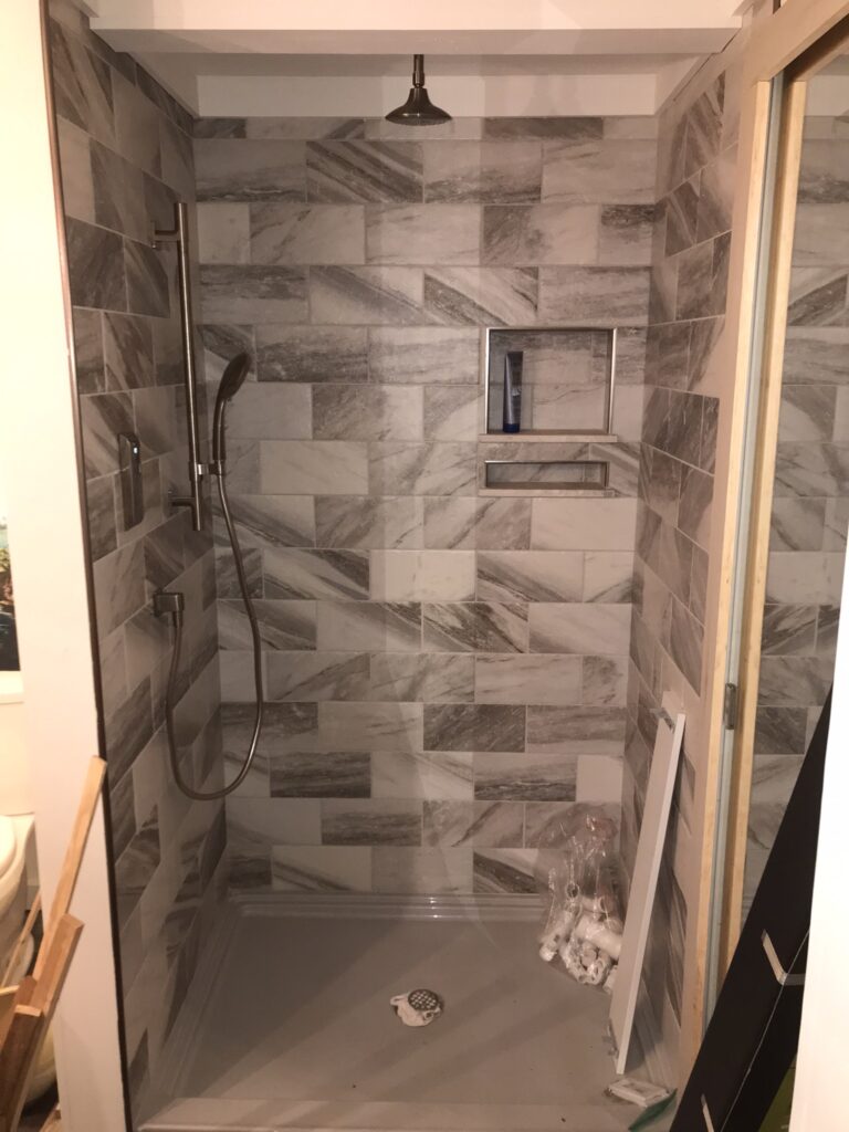 Tub to shower conversion and tiling project in Roswell, Georgia.